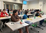 Campers hear from people working in transportation careers, like civil engineers, on their first full day of camp at Portland State on Aug. 4, 2025.