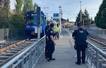 Portland police respond to reports of a stabbing on a TriMet MAX Light Rail train Saturday, Sept. 2, 2023, in Southeast Portland, Ore.