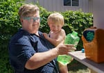 Kirby Orr, left, and her son at their home in Oregon City, Aug. 29, 2022. Long COVID-19 forced Orr to worked reduced hours for roughly one year, resulting in debt. 