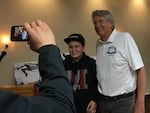 Former Olympic high jump champion Dick Fosbury posed with Cooper Cox of Medford, Ore. during a book signing appearance in 2018. Fosbury, who grew up in Medford, won the high jump gold medal at the 1968 Mexico City Olympics and set an Olympic and U.S. record at the time.