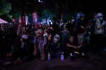 Protesters sit outside the Atomic Bomb Dome ahead of the memorial service to mark the 80th anniversary of the WWII U.S. atomic bombing in Hiroshima on Aug. 6, 2025, in Japan.