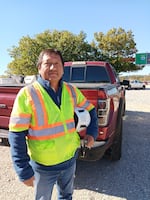 Rurick Palomino stands beside the Theodore Roosevelt Bridge in Washington, D.C., where his crew of 30 workers is doing demolition and repair.