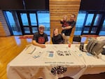 From left, Robert Coberly, Tulalip, tribal crisis counselor; Heaven Arbuckle, tribal crisis counselor lead; and Arbuckle's husband, Brandon Hachett, holding their son Roman. The group had an information table for the Native and Strong Lifeline at a recent Missing and Murdered Indigenous People event in Tulalip, Washington.
