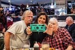 Former U.N. ambassador and 2024 Republican presidential hopeful Nikki Haley takes a selfie with voters at Mary Anne's Diner in Amherst, N.H.