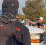 A still from a video showing a man pulling a gun on a crowd in Bend, Oct. 3, 2020.