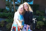 Rockwood resident Dawna Burnett is walking along SE Stark with her granddaugher Tristyn on June 11, 2026. Burnett said she spent the 2021 Heat Dome in her bathtub to survive the heat. Since then, she's installed an air conditioning unit in her home.