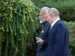 Russian President Vladimir Putin and Indian Prime Minister Narendra Modi take a walk during an informal meeting at the Novo-Ogaryovo state residence, outside Moscow, on July 8.