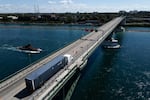 A truck passes over the Peace Bridge between Canada and the United States, in Fort Erie, Ontario, on August 18, 2026.