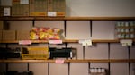 Emptied shelves of the stock room are seen after a food bank distribution event.