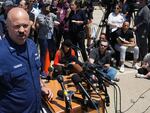 U.S. Coast Guard Capt. Jamie Frederick, center left at microphone, faces reporters during a news conference, Wednesday, June 21, 2023, at Coast Guard Base Boston, in Boston. (AP Photo/Steven Senne)