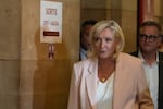 Far-right leader Marine Le Pen arrives at the courtroom for the verdict of her appeals trial, in Paris, France, Tuesday, July. 7, 2026.
