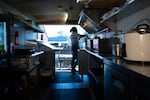Jermaine Ellis preps stirs curry before the lunch rush in his food truck in Sisters, Ore., on June 6, 2025.