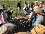 Soil Scientist Andy Gallagher demonstrates the different types of soils found in the Willamette Valley at a dry farming event in Philomath, Oreg.