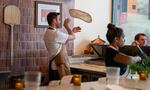 Chef Chris Flanagan of Grana Pizza Napoletana in Portland, Ore. tosses pizza dough in front of customers, Aug. 9, 2024. Flanagan started Grana with his wife Maya Setton in October 2023.