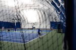 High school tennis players compete at the Portland Tennis Center in Portland, Ore., on May 15, 2026. The city is considering handing over the public tennis center to the United States Tennis Association in light of budget constraints.