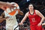 FILE - Las Vegas Aces guard Jackie Young (0) looks for a pass as Portland Fire center Megan Gustafson (17) rushes in to block at the Moda Center in Portland, Ore., on July 9, 2026. The Portland Fire played the Las Vegas Aces, losing 88-80.