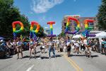 Participants carry balloons spelling out "Pride" during the 51st LGBTQ Pride Parade in Chicago on June 26, 2022.