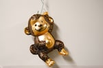 A monkey ornament hangs from an office door on Thursday, Aug. 21, 2025, at the Washington National Primate Research Center on the University of Washington campus in Seattle.