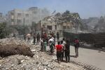 Palestinians inspect the rubble following Israeli strikes on in Gaza City on Saturday.