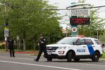 Portland police respond to reports of a person with a gun near Parkrose High School in Portland, Ore., on Friday, May 16, 2019.  
