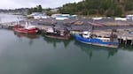 Boats park at a dock.