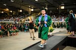 Logan, a participant in OPB's Class of 2025 project, steps off the graduation stage on Friday, June 7, 2024, at the Oregon State Fairgrounds in Salem, Ore.