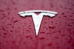FILE - A Tesla logo is shown on Feb. 27, 2024, in Charlotte, N.C. Authorities in Washington announced Tuesday, July 30 that the Tesla that hit and killed a motorcyclist near Seattle in April was operating on the company’s “Full Self Driving” system. (AP Photo/Chris Carlson, File)