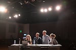 (Left to right) KVAL's Kendall Bartley reviews debate logistics with journalists before the gubernatorial debate in Eugene, Ore., at the University of Oregon, Oct. 1, 2026. Journalists pictured are Ben Botkin of the Lookout Eugene-Springfield, Nigel Jaquiss of the Oregon Journalism Project and University of Oregon journalism student Bayla Orton. 