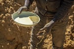 An artisanal miner, locally known as a zama-zama, mines for gold at a mining operation in Stormhill, west of Johannesburg, on Aug. 11, 2023.