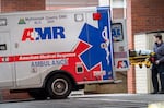 An American Medical Response ambulance prepares to leave the emergency department at Legacy Good Samaritan Medical Center in Portland, Jan. 11, 2024. In November 2023, Multnomah County fined ambulance service provider more than $500,000 for delayed response times to 911 calls. AMR has appealed the fine and blamed the delays largely on staffing challenges worsened by the county's requirement of two paramedics per ambulance deployed to an emergency.