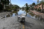 A flooded street with debris in the aftermath of Hurricane Milton, in Siesta Key, Fla., on October 10, 2024. The monster weather system sent tornadoes spinning across the state and flooded swaths of the Tampa Bay area after the storm rapidly intensified to a top-of-scale category 5 major hurricane.