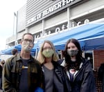 (Left to right) Matthew and Laura St. John wait with their daughter Jillian before she has a COVID-19 test during move-in at Oregon State University in Corvallis, Ore. on Sept. 19, 2021.