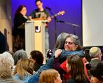 Women embrace before a community vigil at the Boulder Jewish Community Center to mark an attack in Boulder, Colo., Wednesday, June 4, 2025. 