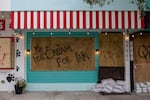 A boarded up business is seen on Sept. 27, 2022, in Gulf Port, Fla., before Hurricane Ian hit the area.