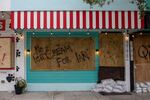 A boarded up business is seen on Sept. 27, 2022, in Gulf Port, Fla., before Hurricane Ian hit the area.