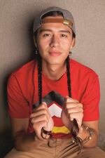 Rapper Frank Waln (Sicangu Lakota) told Wilbur that personal sovereignty extends to his own body: "I grow my hair long and wear braids. It's more about not fitting into the colonial gender binaries."