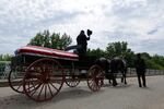 The casket of Rep. John Lewis moves over the Edmund Pettus Bridge by horse drawn carriage during a memorial service for Lewis, Sunday, July 26, 2020, in Selma, Ala. Lewis, who carried the struggle against racial discrimination from Southern battlegrounds of the 1960s to the halls of Congress, died Friday, July 17, 2020.