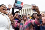 From left to right: Nicole Tinson from L.A., Teresa Roberts, from Shannon, Mississippi, Sheila Carson, from D.C. and Regina Langley, middle, from New Jersey. Langley was holding a cell phone watching the Senate voting on the conformation of Ketanji Brown Jackson to the Supreme Court. Full story here.