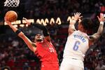 Portland Trail Blazers forward Toumani Camara (33) drives to the basket as Oklahoma City Thunder forward Jaylin Williams (6) defends during the second half of an NBA basketball game Sunday, Jan. 26, 2025, in Portland, Ore.