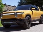 It's still unclear whether the Rivian R1S SUV, seen here, will qualify for a tax credit for electric cars after changes to the rules. Even if it does, a price cap may be a barrier for most purchasers: only a bare-bones version of the premium electric SUV squeaks under the $80,000 price cap.