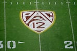 FILE - In this Aug. 29, 2019, file photo, the Pac-12 logo is displayed on the field at Sun Devil Stadium.
