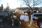 People lined the streets outside the Kanab Church of Jesus Christ of Latter-day Saints to watch the hearse carrying LaVoy Finicum's coffin.