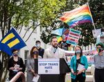 Alabama Rep. Neil Rafferty speaks in support of transgender rights during a rally outside the Alabama State House in 2021. The state is using the Dobbs ruling, which overturned Roe v. Wade and ended abortion access as a federal right, to argue it has the authority to ban gender-affirming medical care.
