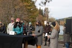 Bend city councilor Gena Goodman-Campbell, Mayor Sally Russell and Rabbi Johanna Hershenson read statements from former Deschutes County employees at a press event in Drake Park attended by about 30 women, Oct. 26, 2020. 