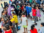 A line of civilians are waiting for food at the soup kitchen in Gaza.