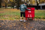 A voter drops off a ballot at Clark College in Vancouver, Wash., on Election Day Tuesday, Nov. 4, 2025.
