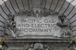 In this April 16, 2020, file photo, a Pacific Gas & Electric sign is displayed on the exterior of a PG&E building in San Francisco.