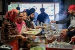 Food is distributed during langar at the Sikh Center of Oregon in Beaverton, Ore., on March 10, 2024. The gurdwara serves two meals every Sunday, which are available to everyone.