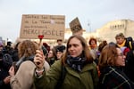 A woman holds a placard reading in French "All women on Earth support you, thank you Gisele" as people gathered outside the courthouse in Avignon, France, on Dec. 19, 2024, in advance of the verdicts being read out from the trial of an ex-husband and more than four dozen other men who were found guilty of aggravated rape against Gisèle Pelicot.