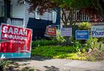 Several yard signs for local candidates are displayed in front of a house in the Southeast Portland, Ore., neighborhood of Brooklyn on Monday, April 20, 2020.